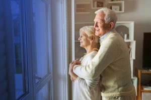 Older Couple Enjoying View From Window - Surgical Specialists of San Antonio Difference